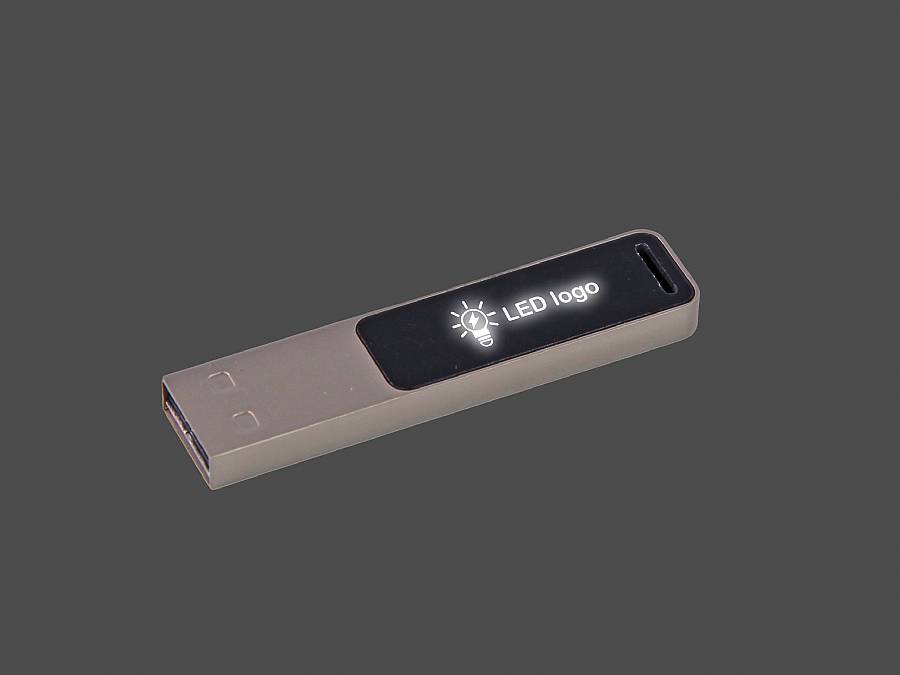 USB-Stick in schlanker Bauform mit beleuchtetem Bereich für individuelles Logo und edlem Metallgehäuse.