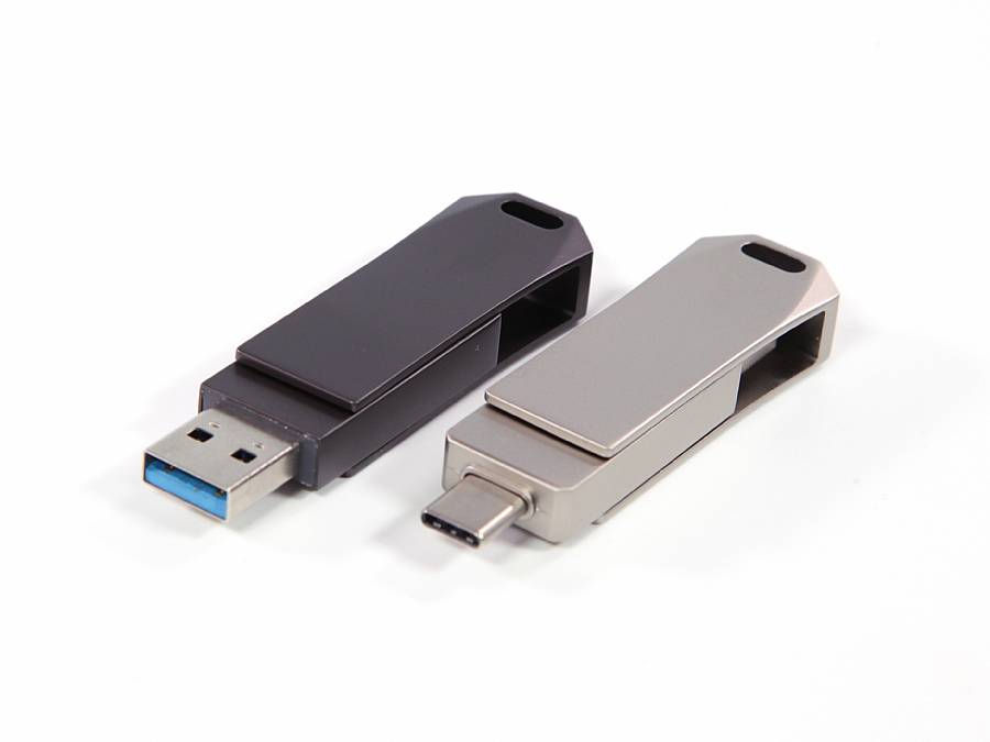 USB-Stick im modernen Design mit schwarzem und silbernem Gehäuse sowie verschiedenen Anschlussmöglichkeiten.