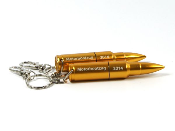 USB-Stick in Form von Patronen mit goldenem Gehäuse und Platz für individuelle Gravuren oder Logos. Ideal als Werbeartikel.